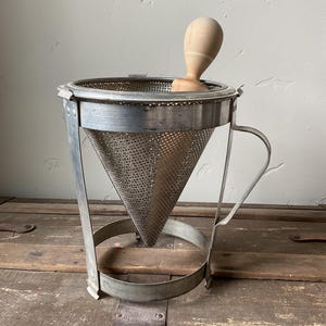 Vintage standing metal sieve with wooden pestle, metal chinois, strainer, home canning juicer, cone mill, for the home kitchen circa 1950-60
