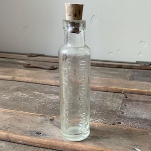 Antique Dr Thompson’s Eye Water, corked embossed glass bottle, pharmaceutical, advertising, apothecary, optical medicine, collectible glass.