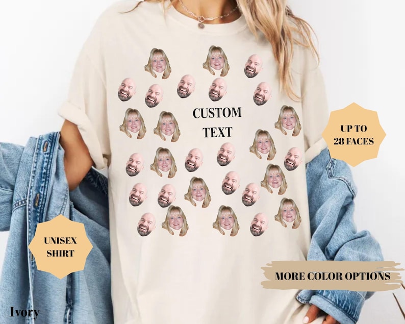 May include: Ivory unisex shirt with a custom text area and multiple faces printed on the front. The shirt has rolled-up sleeves and is paired with a denim jacket. Text on the shirt reads "CUSTOM TEXT" and "UP TO 28 FACES".