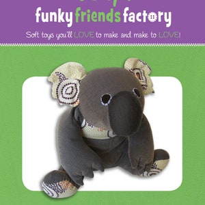 May include: A gray and white koala soft toy pattern with the text "Kiki KOALA" and "26cm / 10 inch Soft Toy Koala".