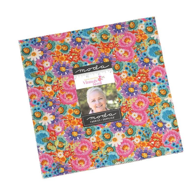 May include: A Moda Fabrics Vintage Soul charm pack featuring a colorful floral print with a variety of flowers in shades of pink, blue, orange, yellow, and purple. The fabric is designed by Corey Yoder.