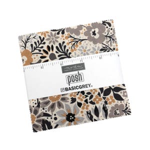 May include: A bundle of fabric squares with a floral pattern in shades of gray, black, and tan. The fabric is wrapped with a white band that reads "posh" and "BASICGREY". A ruler is printed on the band.