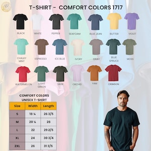 Puede incluir: Una exhibici&oacute;n de camisetas unisex Comfort Colors en varios colores, incluyendo negro, blanco y azul vaquero. La imagen tambi&eacute;n muestra una tabla de tallas con medidas en pulgadas. El texto "T-Shirt - Comfort Colors 1717" est&aacute; en la parte superior.