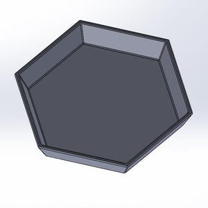 May include: A gray hexagonal tray with a smooth, flat surface. The tray is made of a sturdy material and has a modern design.
