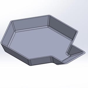 May include: A grey, irregularly shaped, plastic tray with a raised edge. The tray has a unique design with a small, curved handle on one side.
