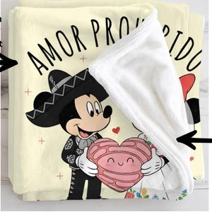 a cartoon character wearing a sombrero and holding a heart, with text that says "Amor Paz" (love) and "Sellartify" (sell).