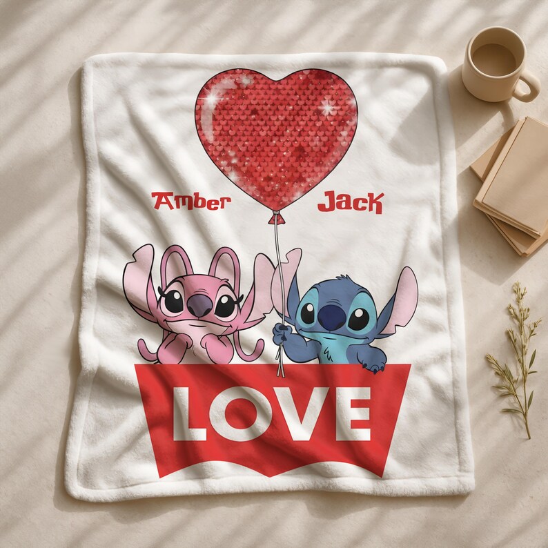 A blanket featuring the characters Stitch and Amber from the movie Lilo & Stitch, along with a heart-shaped balloon and the word "LOVE" written on it.