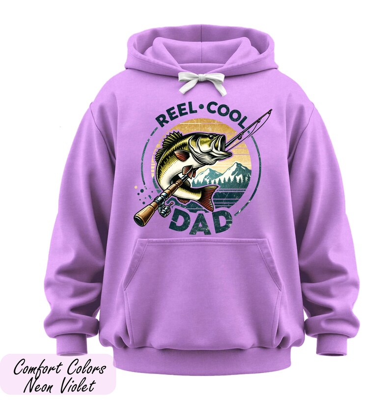 A purple hoodie with a graphic design featuring a fish and the text "REEL-COOL DAD" printed on it.