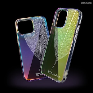 May include: Two clear phone cases with a leaf skeleton design. One case has a gradient of purple, blue, and orange, while the other has a green and yellow gradient. The name "Elizabeth" is written on one case.