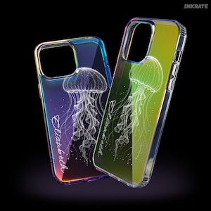 May include: Two iridescent phone cases with a jellyfish design. The cases have a clear border and a gradient background of blue, green, and yellow. The name "Elizabeth" is written in a script font on the front of each case.