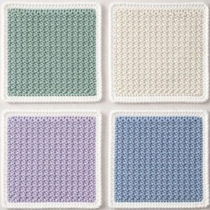 May include: A set of four square crochet coasters featuring a textured stitch pattern. Each coaster has a solid colored center in sage green, cream, lavender, or dusty blue, and is finished with a clean white border around the entire perimeter.