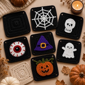 May include: A collection of square crochet coasters featuring Halloween motifs including a white spiderweb, a white skull, a red and white eyeball, a purple witch hat, a white ghost, and an orange pumpkin, all set against black yarn squares.