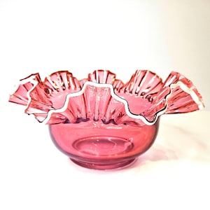 Cranberry Glass Bridal Basket with White Snowcrest Edge. Measures 10&quot; in diameter.
