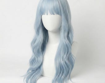 May include: A long, wavy, light blue wig featuring straight-cut bangs. The synthetic hair has a soft, pastel blue hue and falls in loose, flowing waves down to the chest area, displayed on a plain white mannequin head and neck form.