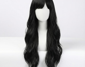May include: A long, wavy black wig featuring straight-cut bangs that frame the forehead. The hair has a smooth, dark texture and falls past the shoulders in loose, flowing waves, displayed on a plain white mannequin head form.