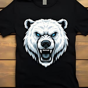 May include: Black t-shirt featuring a detailed illustration of a polar bear's head. The bear has white fur, blue eyes, and an open mouth displaying teeth. The design is centered on the shirt, creating a bold graphic.