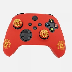 May include: Red Xbox controller with Manchester United logo and red, yellow and black buttons.