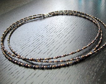 Three strand seed pearl and silver necklace