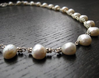 Cream-colored freshwater cultured pearl and silver-plated bead necklace