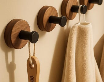 Gancho de pared de madera de nogal: Soporte adhesivo para toallas y batas sin necesidad de taladrar.