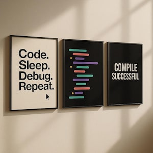 May include: Three framed prints with a coding theme. The left print has the text "Code. Sleep. Debug. Repeat." with a mouse cursor icon. The middle print has a black background with colourful lines of code. The right print has a black background with the text "COMPILE SUCCESSFUL" in white.
