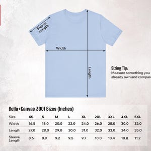May include: Light blue t-shirt with sizing information and measurements in inches. The shirt's dimensions are indicated with arrows for width, length, and sleeve length. The Bella+Canvas 3001 sizes are listed, with a sizing tip to compare measurements.