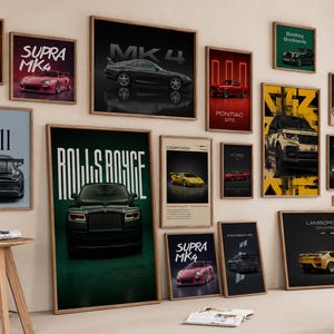 May include: A collection of framed wall art prints featuring various luxury and sports cars, including models labeled Ferrari, Supra MK4, Pontiac GTO, Bentley Brooklands, 911, Rolls Royce, Countach, Ford, and Lamborghini, displayed in a gallery arrangement.