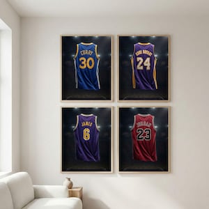 May include: Four framed prints of basketball jerseys. The jerseys are blue, purple, and red, each with a player's name and number. The jerseys are displayed against a dark background with stadium lighting.