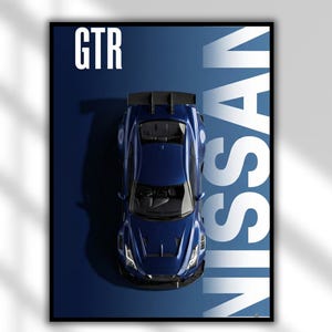May include: A framed poster showing a dark blue Nissan GTR sports car from above. The word "GTR" is in white block letters on the top left, and "NISSAN" is vertically on the right.