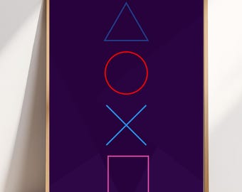 May include: A framed print featuring the iconic PlayStation controller button symbols: triangle, circle, cross, and square. The shapes are in blue, red, and pink, set against a dark purple background. The artwork is displayed in a wooden frame.