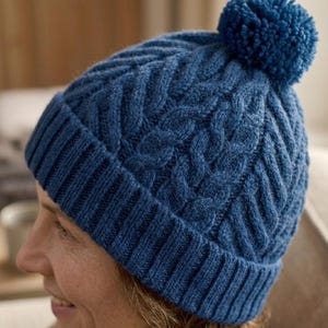 May include: A white ceramic mug with a black handle and the text "But First, Coffee" in a black, handwritten-style font. The mug is likely 11-15 ounces, perfect for a morning beverage.