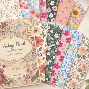 May include: A pack of 24 sheets of 8.5 x 11 inch cardstock labeled Vintage Floral Scrap Book Paper. The collection features various floral patterns including roses, sunflowers, and wildflowers in colors like pink, blue, yellow, and green.