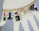 Charm Bracelet, 80 39 s theme bracelet, A bling experience. This bracelet has many gorgeous charms. Check it out.