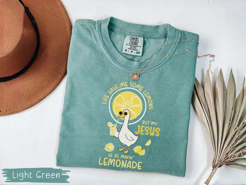 Comfort Colors® Life Gave Me Some Lemons But My Jesus He Be Makin' Lemonade Silly Goose Shirt, Christian Gift For Women, Faith Apparel Unisex Light Green
