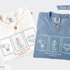 Custom bachelorette beach matching shirts with coastal doodle illustrations, including cocktails, shells, oysters, and bikinis. Personalized bride squad tees for beach trips, bridesmaids, and bach party vacations.
