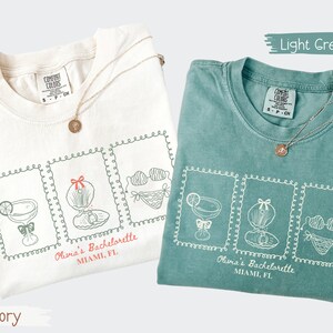 Custom bachelorette beach matching shirts with coastal doodle illustrations, including cocktails, shells, oysters, and bikinis. Personalized bride squad tees for beach trips, bridesmaids, and bach party vacations.