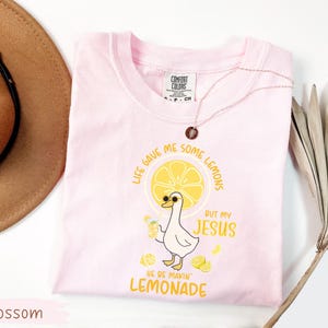 Comfort Colors® Life Gave Me Some Lemons But My Jesus He Be Makin' Lemonade Silly Goose Shirt, Christian Gift For Women, Faith Apparel Unisex Blossom