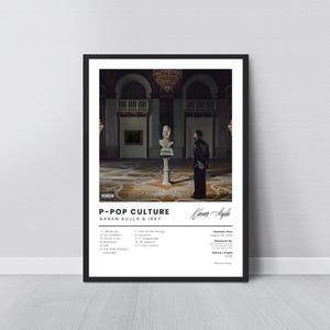 May include: A framed poster featuring the album art for "P-POP CULTURE" by Karan Aujla & Ikky. The artwork shows a person in a black outfit standing in a grand hall. The poster includes the album title, artist names, and tracklist.