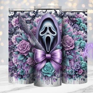 May include: A stainless steel tumbler with a Scream mask design, a purple bow, and a decorative knife, surrounded by purple and teal roses. The design is set against a floral background with a dripping paint effect.
