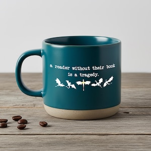 May include: A set of three ceramic mugs with a speckled, matte finish. The mugs are in shades of cream, light gray, and dark gray. Each mug has a simple, minimalist design, perfect for coffee or tea.