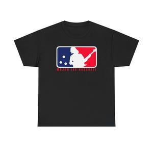 May include: Black t-shirt featuring a white graphic of a baseball logo. The logo depicts a silhouette of a person playing a guitar with the text "Major Lee Bassball".