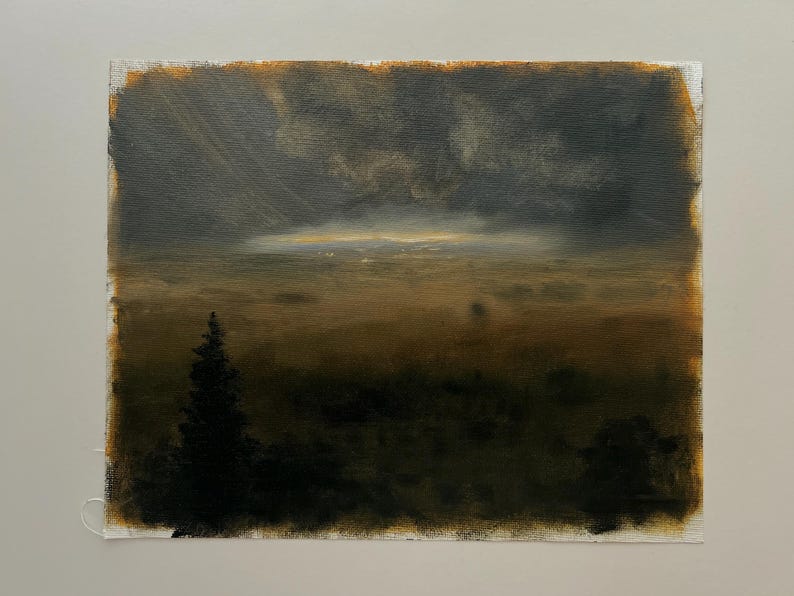 May include: An oil painting on canvas depicting a dark, moody landscape under a stormy sky. A single tall, dark evergreen tree stands in the foreground against a vast, hazy field. The horizon glows with a faint, golden light beneath heavy clouds.