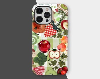 May include: A phone case featuring a collage of fruit and nature-themed illustrations. The design includes red apples, strawberries, a ladybug, a four-leaf clover, and green ivy leaves, set against a white and green checkered background.