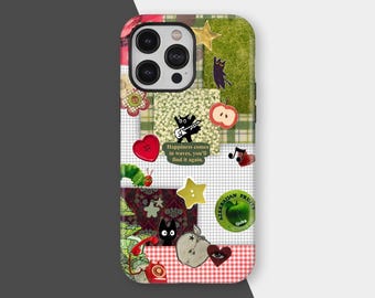 May include: A colorful phone case with a patchwork design. The case features various stickers, including a red heart, a green caterpillar, a black cat, and an apple. The text "Happiness comes in waves, you'll find it again" is also visible.