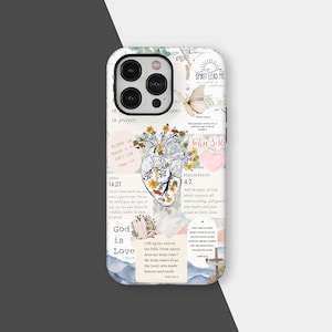 May include: A white phone case with a collage design featuring a floral heart, Bible verses, and the words "Spirit Lead Me" and "God is Love." The case has a glossy finish and a camera cutout.