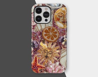 May include: A decorative phone case featuring a beaded design with a sun, starfish, and citrus slice. The case has a mix of colors, including gold, orange, red, and pink, with a white and gray background.