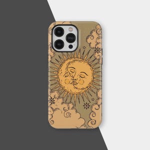 May include: A phone case featuring a celestial design. The case has a tan background with a sun and moon kissing in the center, surrounded by clouds, stars, and sun rays. The case has a glossy finish and a camera cutout.