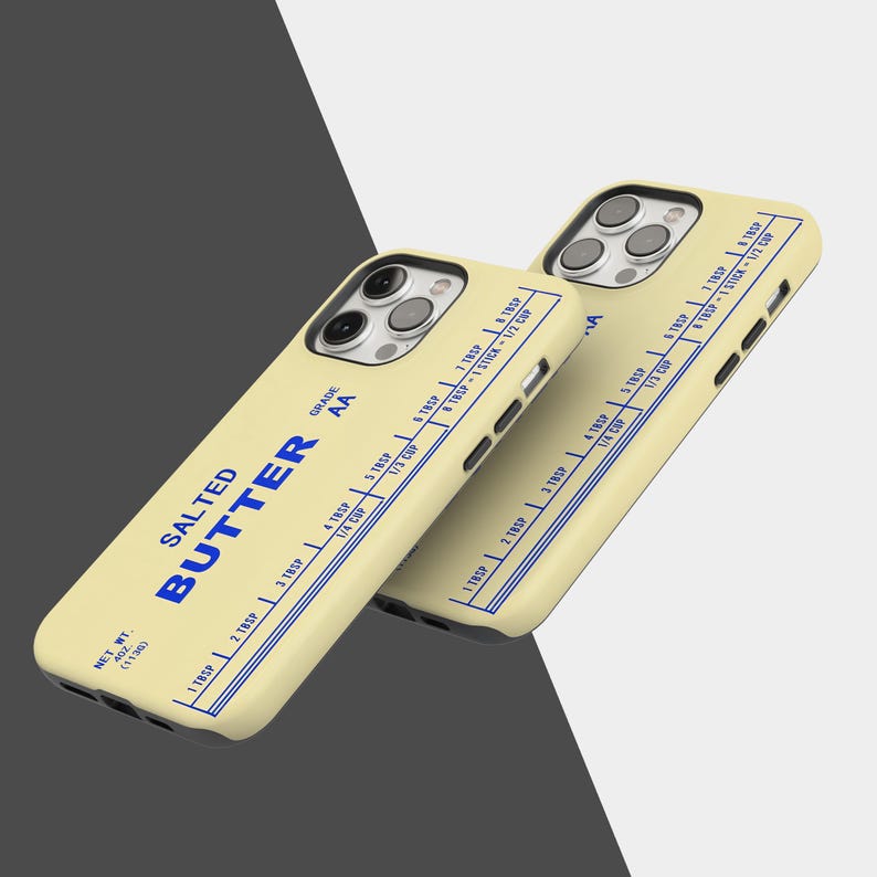 May include: Two phone cases with a butter-themed design. The cases are light yellow with blue text that reads "SALTED BUTTER" and measurement markings. The cases have a net weight of 4 oz (113g).