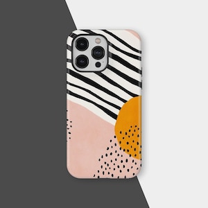 Puede incluir: Una funda de teléfono con un diseño abstracto. La funda presenta un fondo blanco con rayas negras, una sección de color melocotón y un círculo naranja con puntos negros. Pequeños puntos negros están dispersos por el diseño.
