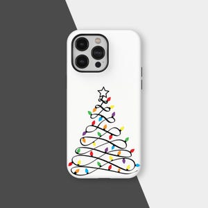 May include: White phone case featuring a black line drawing of a Christmas tree made of string lights. The lights are in various colors, including red, yellow, green, blue, and purple. A star tops the tree.